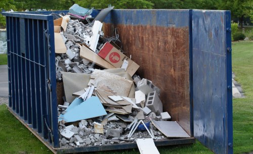 Workers segregating construction waste on a Plaistow building site